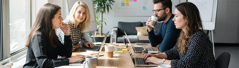 Marketing team on laptops in office