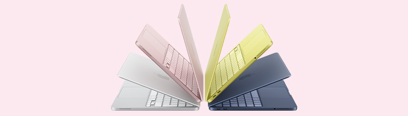 MacBook neo in sliver, blush, citrus, indigo. Slightly open and arranged in arch formation